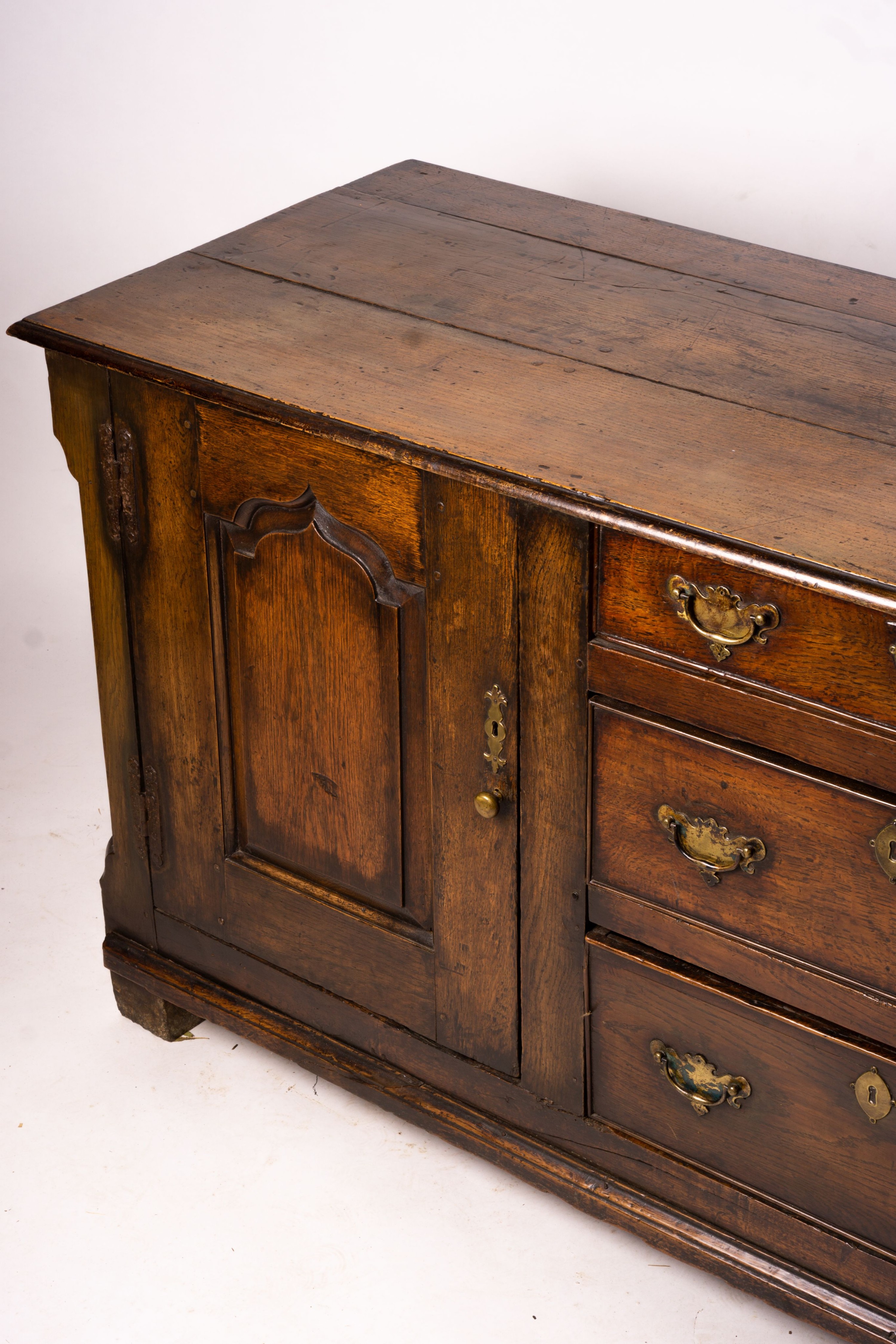 An 18th century oak low dresser base, length 191cm, depth 56cm, height 78cm